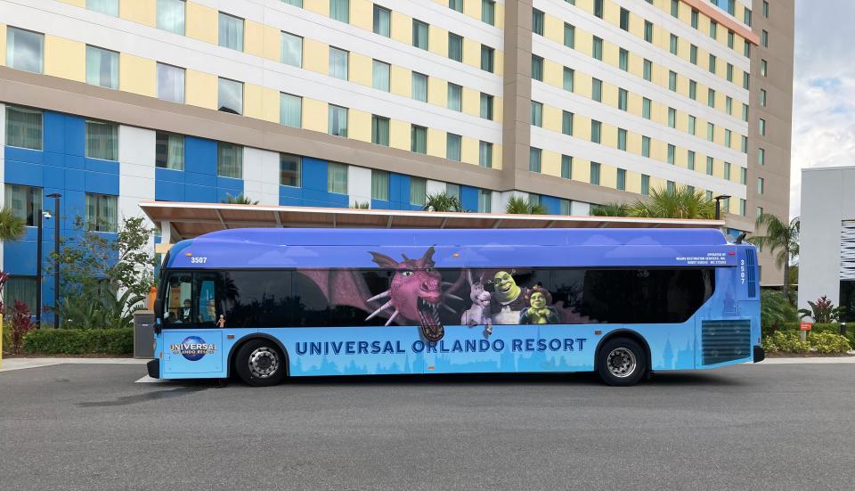 blue bus parked outside of dockside resort in orlando
