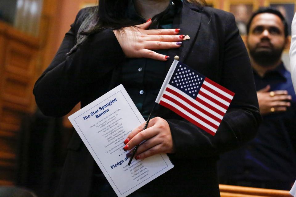 Candidates for U.S. citizenship take the Oath of Allegiance during a naturalization ceremony for new citizens at City Hall in Jersey City, N.J., on Feb. 22. (Photo: Kena Betancur/AFP/Getty Images)