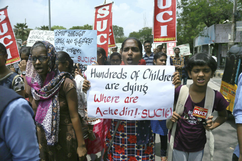 Activists of Socialist Unity Centre of India (Communist) shout slogans condemning deaths of more than 100 children in an encephalitis outbreak this month in eastern Bihar state, during a protest in Hyderabad, India, Monday, June 24, 2019. (AP Photo/Mahesh Kumar A.)