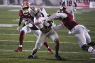 Ohio State wide receiver Jaxon Smith-Njigba (11) battles for the ball with Indiana defensive back Devon Matthews (1) in the second half of an NCAA college football game in Bloomington, Ind., Saturday, Oct. 23, 2021. (AP Photo/AJ Mast)