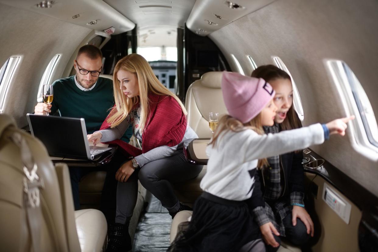 family in a private airplane