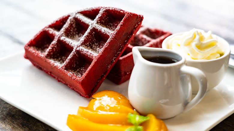 Red velvet waffle slice on plate