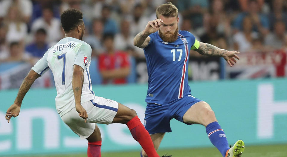 England’s Raheem Sterling, left, fights for the ball with Iceland’s Aron Gunnarsson during the Euro 2016 round of 16 soccer match between England and Iceland, at the Allianz Riviera stadium in Nice, France. (Claude Paris/AP)