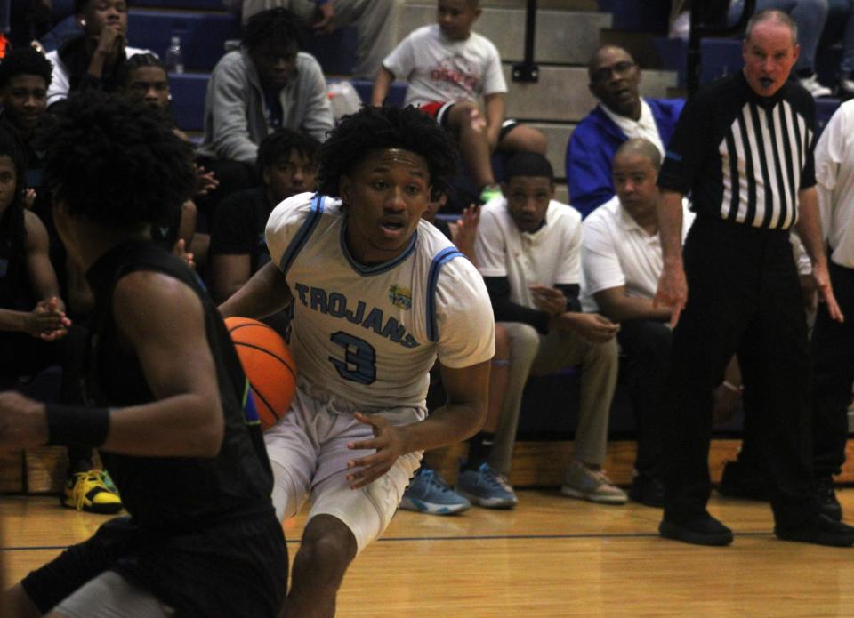 Ribault guard Caleb Williams (3) pulls up to shoot against Riverside in Tuesday's Gateway Conference semifinal.