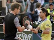 Andy Murray of Britain (L) shakes hands with David Ferrer of Spain after winning their men's quarter-final match during the French Open tennis tournament at the Roland Garros stadium in Paris, France, June 3, 2015. REUTERS/Gonzalo Fuentes