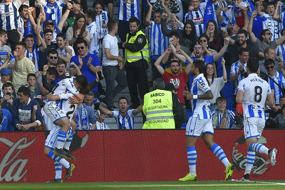 Real Sociedad's players celebrate at the end of the Spanish League football match between Real Sociedad and Real Madrid at the Anoeta Stadium in San Sebastian.