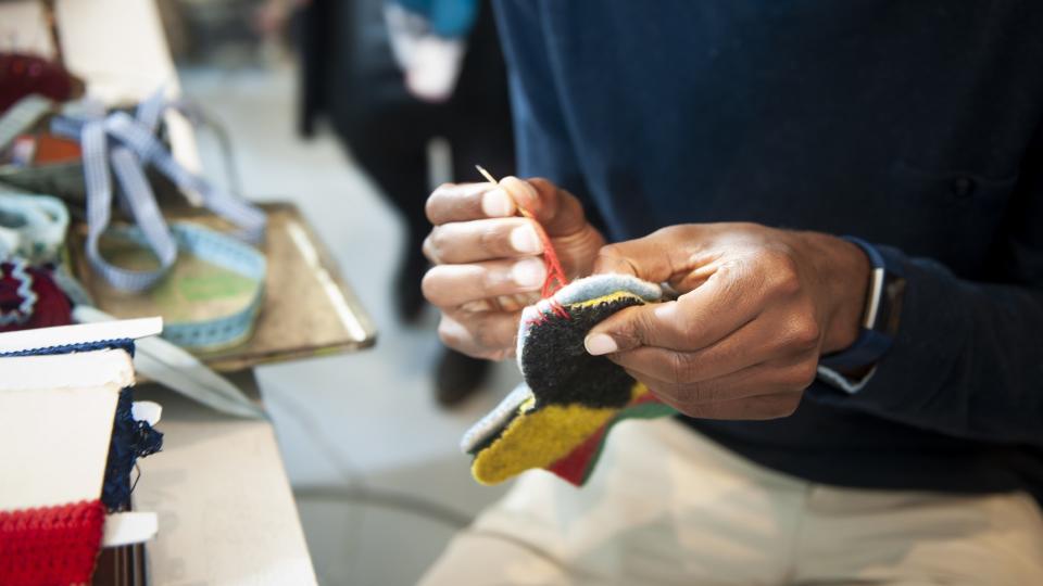 a person makes a crafted felt item