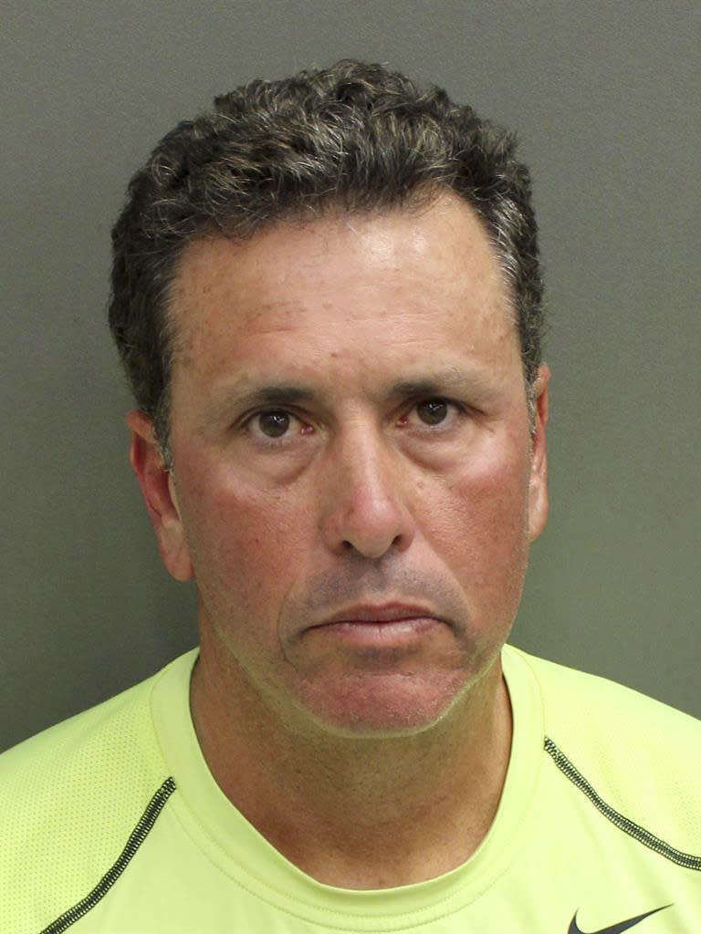 FILE - This undated photo provided by Orange County Corrections shows Gustavo Falcon, the last of South Florida's "Cocaine Cowboys". Falcon was arrested Wednesday, April 12, 2017, some 26 years after he went on the lam, while on a 40-mile bike ride with his wife near the Orlando suburb where they apparently lived under assumed names. Gustavo Falcon, 55, also known as Taby, was booked into the Orlando County jail, Wednesday. He is scheduled to have his first appearance in Orlando federal court on Thursday, before his expected transfer to Miami. (Orange County Corrections via AP)