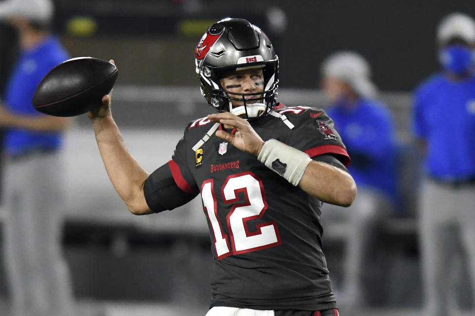 Tampa Bay Buccaneers quarterback Tom Brady (12) throws a pass before an NFL football game against the Los Angeles Rams Monday, Nov. 23, 2020, in Tampa, Fla. (AP Photo/Jason Behnken)