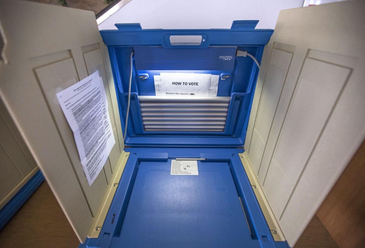 Voting booths await voters during absentee voting inside the County-City Building in South Bend.