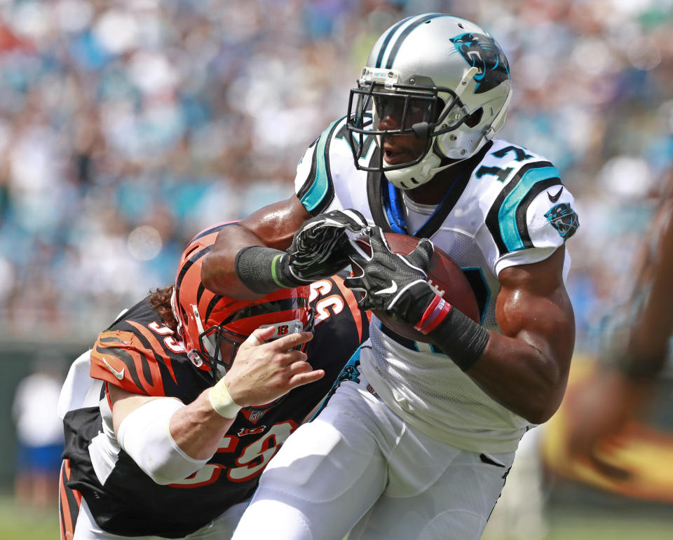 Carolina Panthers' Devin Funchess (17) scores a touchdown past Cincinnati Bengals' Nick Vigil (59) during the first half of an NFL football game in Charlotte, N.C., Sunday, Sept. 23, 2018. (AP Photo/Jason E. Miczek)