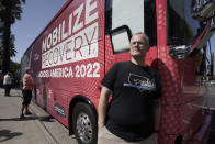 Ryan Hampton, founder of the Voices Project, poses outside the 2022 Mobile Recovery National Bus during a stop in Sacramento, Calif., Wednesday, Sept. 7, 2022. Across the country, people in recovery and relatives of those killed by opioid overdoses are pressing for roles in determining how billions in opioid settlement money will be used. That push is one of the missions of the monthlong nationwide bus tour. (AP Photo/Rich Pedroncelli)