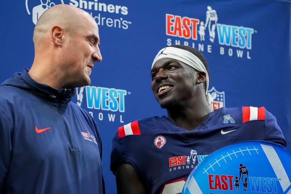 West head coach Mike Kafka, left, of the New York Giants, stands on stage with defensive MVP Jarius Monroe, of Tulane, following the East West Shrine Bowl NCAA college football game in Frisco, Texas, Thursday, Feb. 1, 2024. (AP Photo/Julio Cortez)