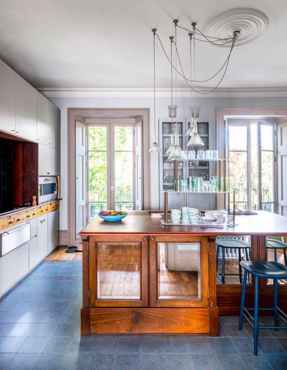 a kitchen with a bar and stools