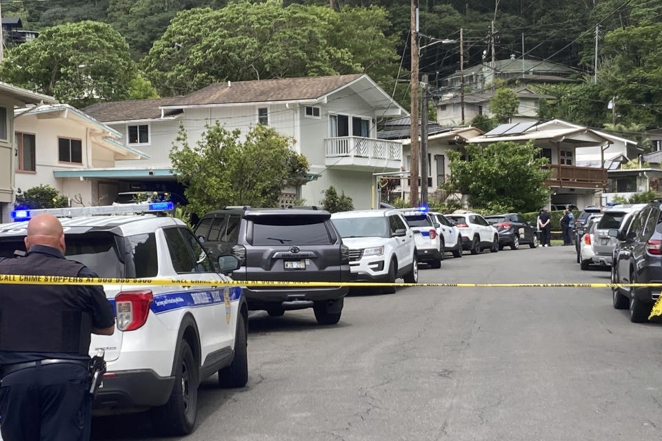 Honolulu police investigate the killings of multiple people at a home in Honolulu's Manoa neighborhood, Sunday, March 10, 2024. (Craig T. Kojima/Honolulu Star-Advertiser via AP)