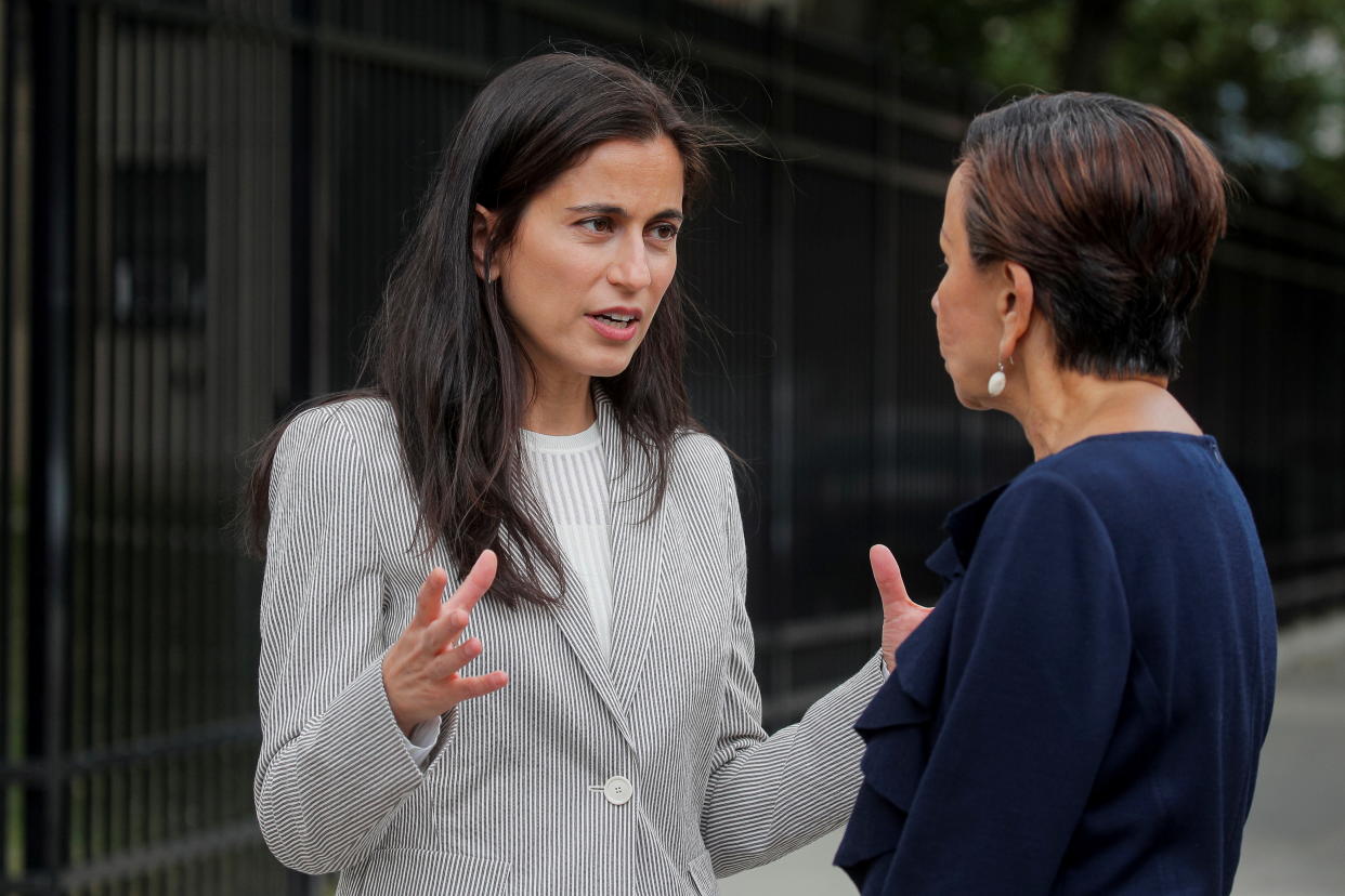 Tali Farhadian Weinstein, candidate for District Attorney of New York, talks to U.S. Rep. Nydia Velazquez, D-N.Y., while campaigning in New York City in May.