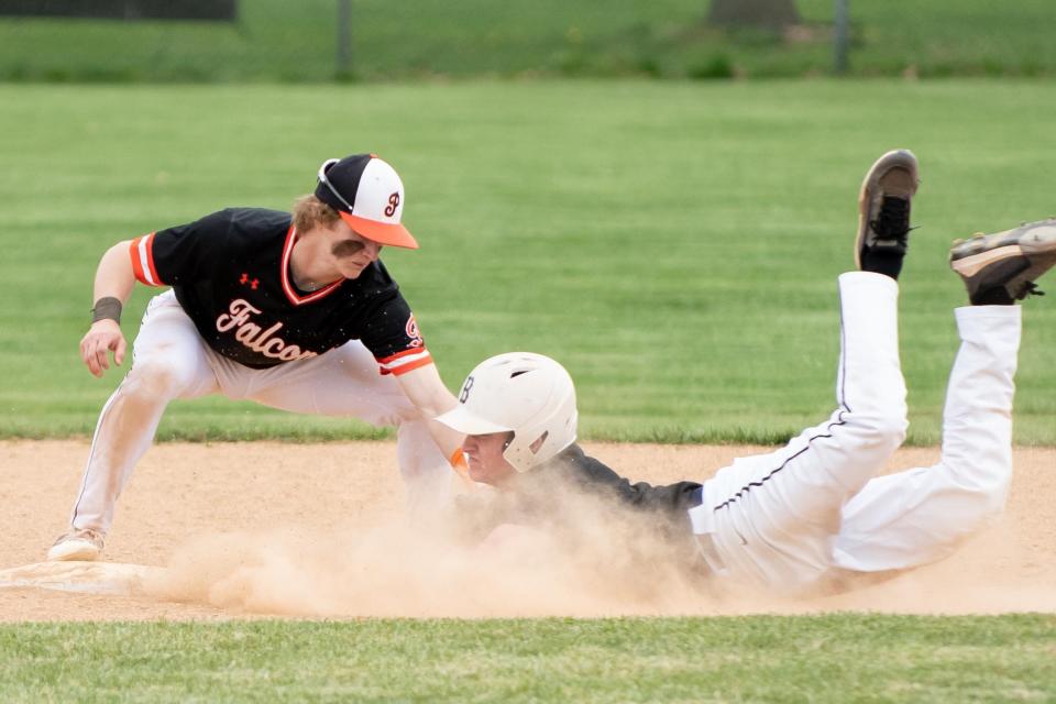 Pennsbury's James Schaffer tags out Bensalem's Jake Wagner at second base during an April 2023 game.