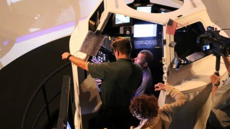 NASA Astronaut Nick Hague kneels down in the Cupola during Robotic Arms training, in preparation for his upcoming mission to space this fall aboard the International Space Center, at Johnson Space Center in Houston, Texas, U.S., May 14, 2018. Picture taken on May 14, 2018.  REUTERS/Ruthy Munoz