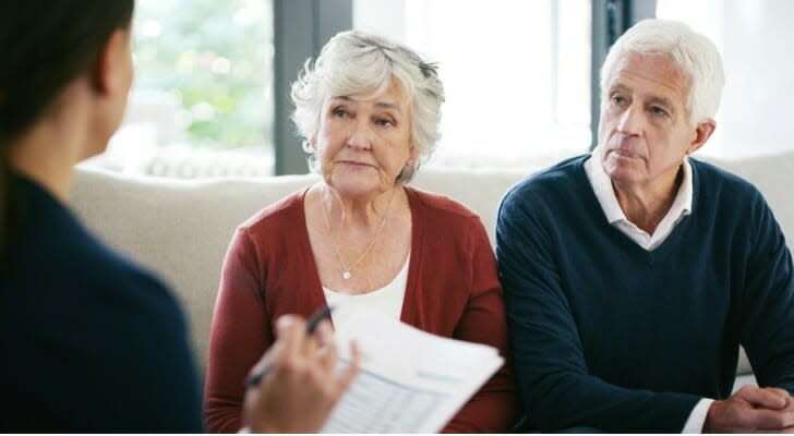 Senior couple discusses estate planning with a financial advisor