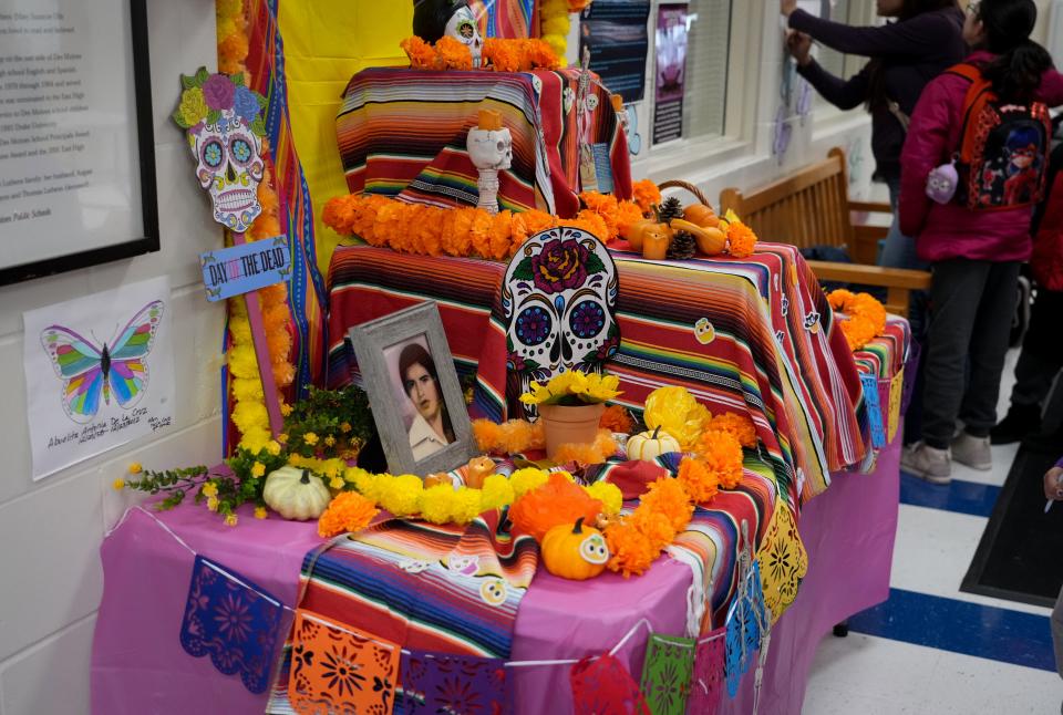 Students from East High School and Capitol View Elementary School set up an ofrenda at Capitol View on Tuesday, Oct. 25, 2022.