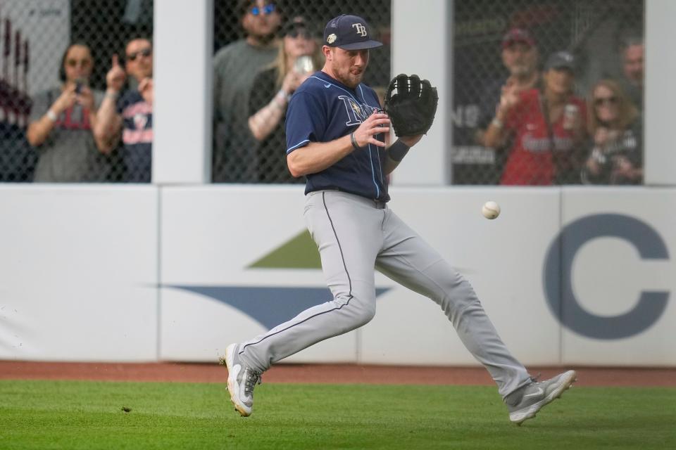 Tampa Bay Rays first baseman Luke Raley fields a ground ball hit for a single by Cleveland Guardians' Will Brennan in the fourth inning Saturday in Cleveland.