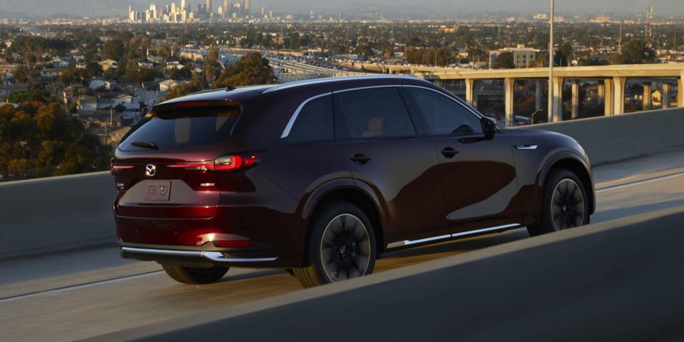 2024 mazda cx90 driving on an interstate