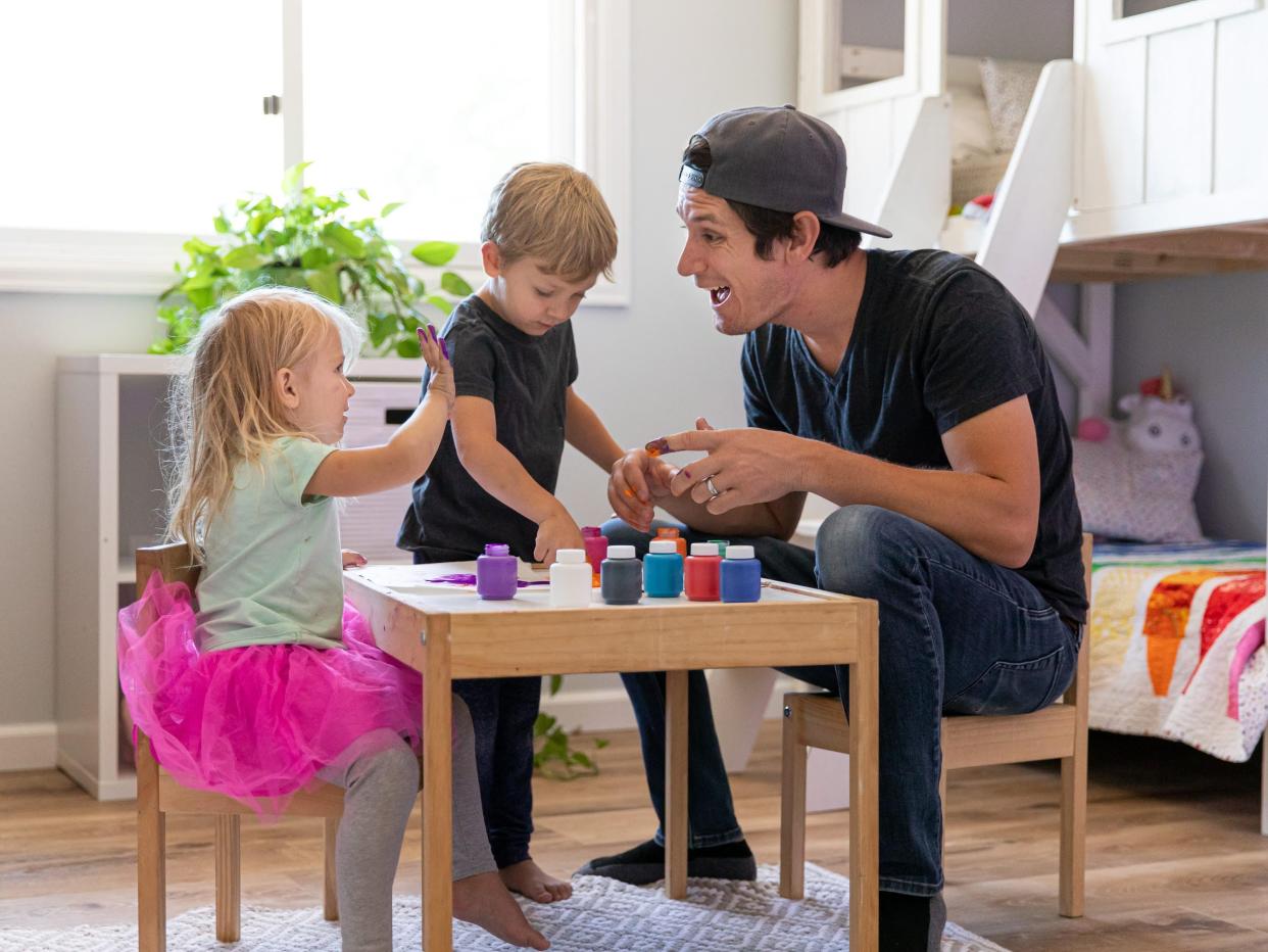 Taylor Calmus and his children fingerpainting