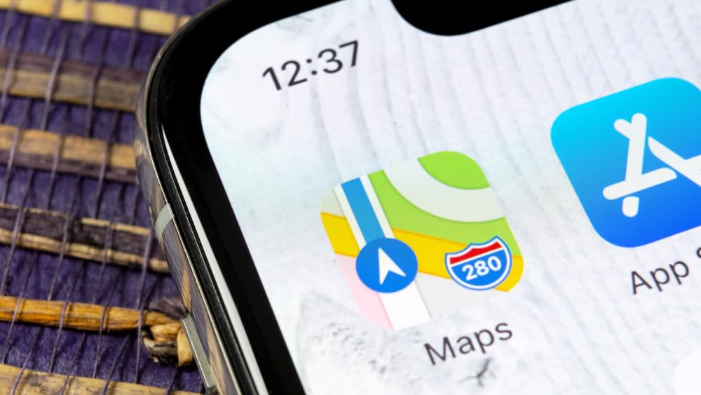  Apple maps logo on iPhone screen. 