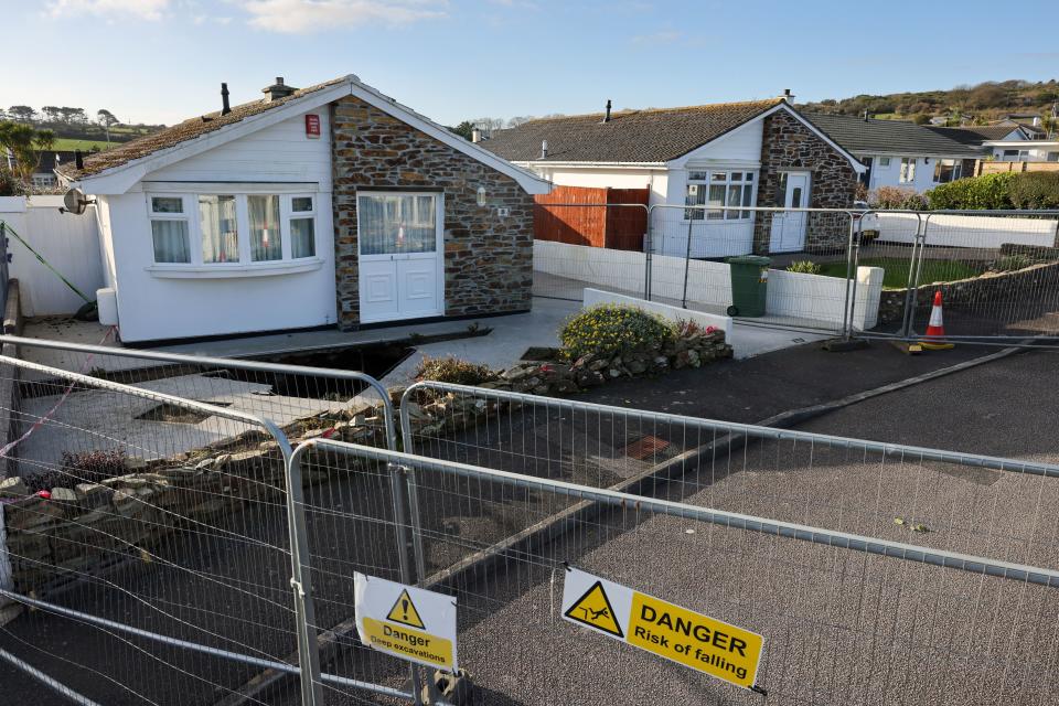A fence has been erected around a property in White House Close in Carbis Bay where a mineshaft has opened up in the front garden.

Credit: CornwallLive/BPM