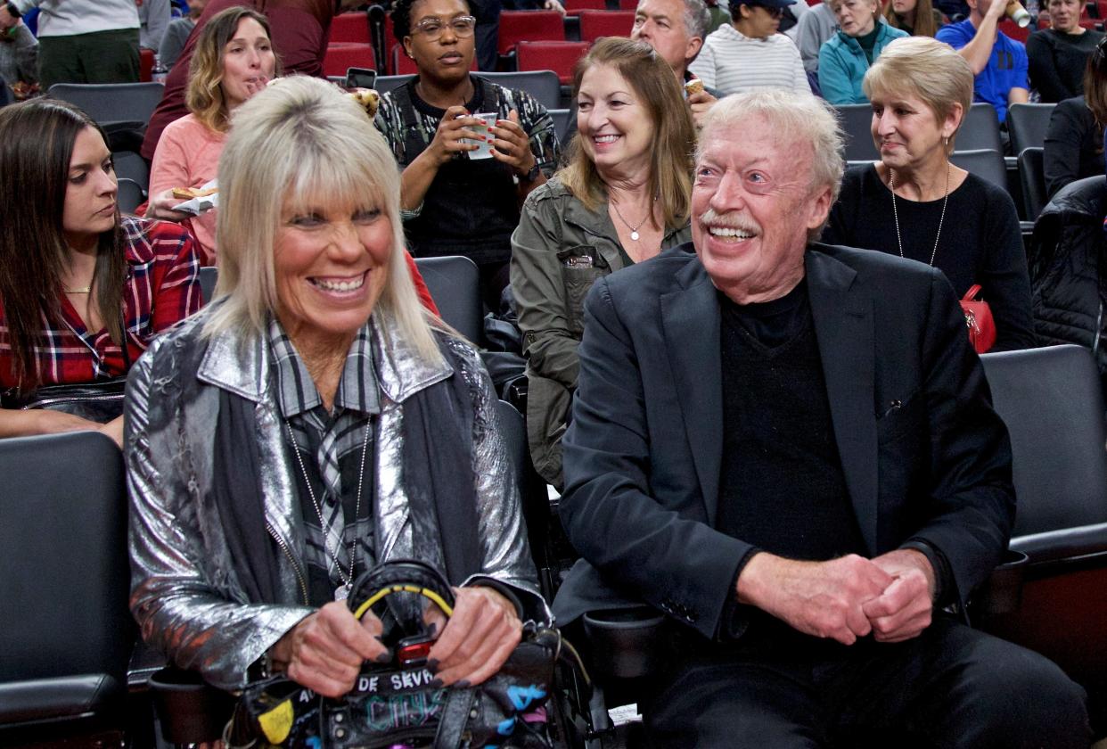 Phil Knight, right, and Penny Knight, left, during the first half of an NCAA college basketball game in the Phil Knight Invitational tournament in Portland in 2017.