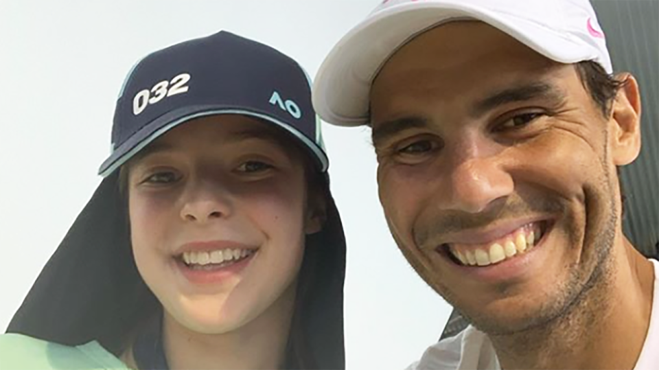 Rafael Nadal is pictured posing for a picture with ball girl Anita Birchall.