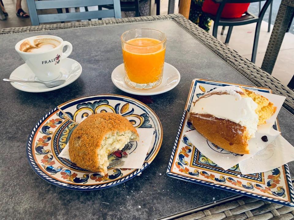 an italian breakfast on a steel table