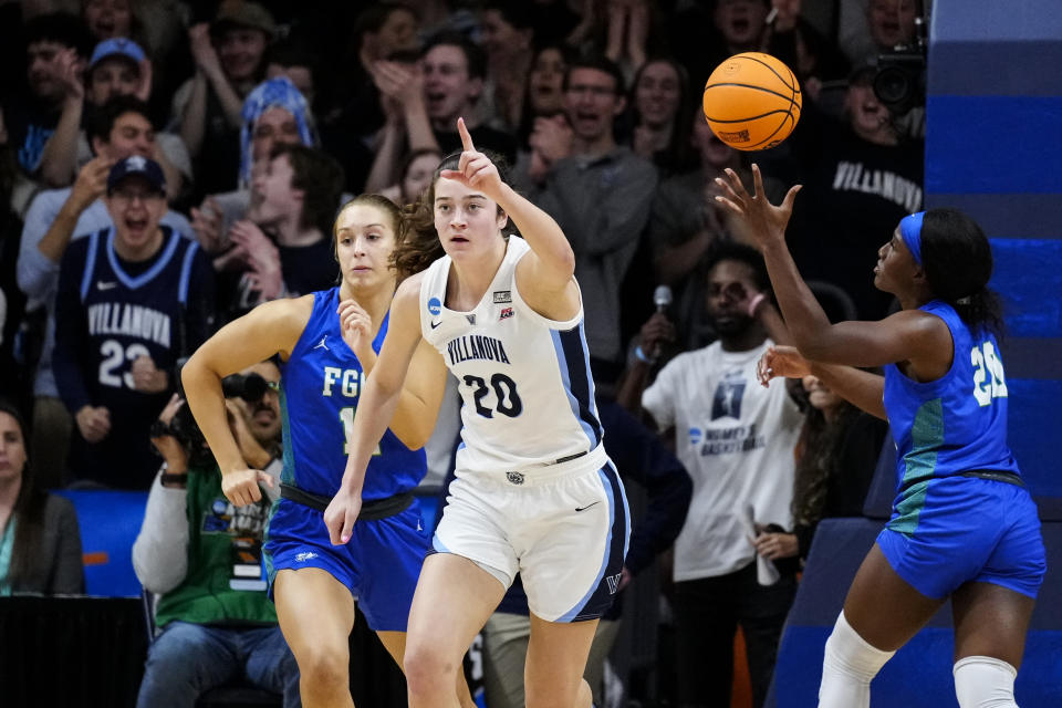 Villanova's Maddy Siegrist (20) reacts past Florida Gulf Coast's Maddie Antenucci, left, and Maddie Antenucci during the first half of a second-round college basketball game in the NCAA Tournament, Monday, March 20, 2023, in Villanova, Pa. (AP Photo/Matt Rourke)