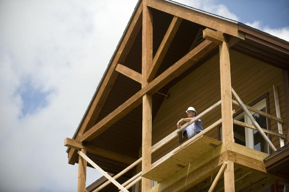 Jay Peak Resort President Bill Stenger checks the view from one of the hotel suites under construction Aug. 5, 2009.