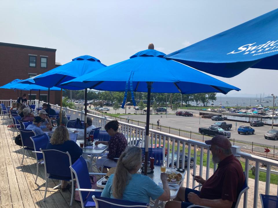 Customers dine on the deck July 26, 2023 at Shanty on the Shore in Burlington.