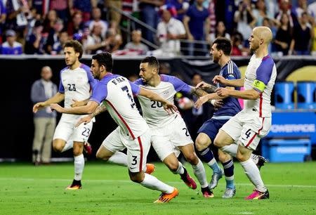 Jun 21, 2016; Houston, TX, USA; Argentina midfielder Lionel Messi (10) is defended by United States midfielder Michael Bradley (4) and defender Geoff Cameron (20) and defender Steve Birnbaum (3) and defender Fabian Johnson (23) during the second half in the semifinals of the 2016 Copa America Centenario soccer tournament at NRG Stadium. Kevin Jairaj-USA TODAY Sports