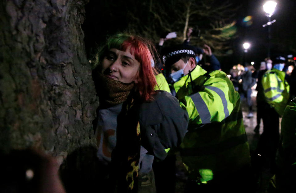 A woman is arrested during a vigil for Sarah Everard on Clapham Common in London, United Kingdom. 