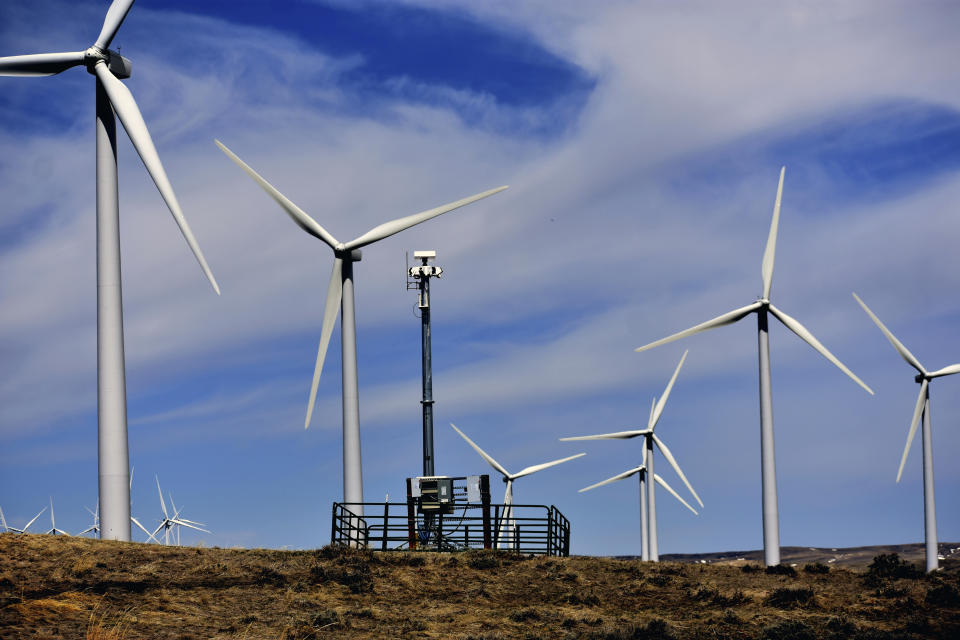 A camera system to detect approaching eagles is seen atop a pole at Duke Energy's Top of the World wind farm, on April 24, 2023, in Rolling Hills, Wyo. The company can shut down its huge turbines when eagles approach too closely, reducing but not eliminating fatal collisions after Duke was criminally prosecuted last decade for not adequately preventing eagle deaths.(AP Photo/Matthew Brown)