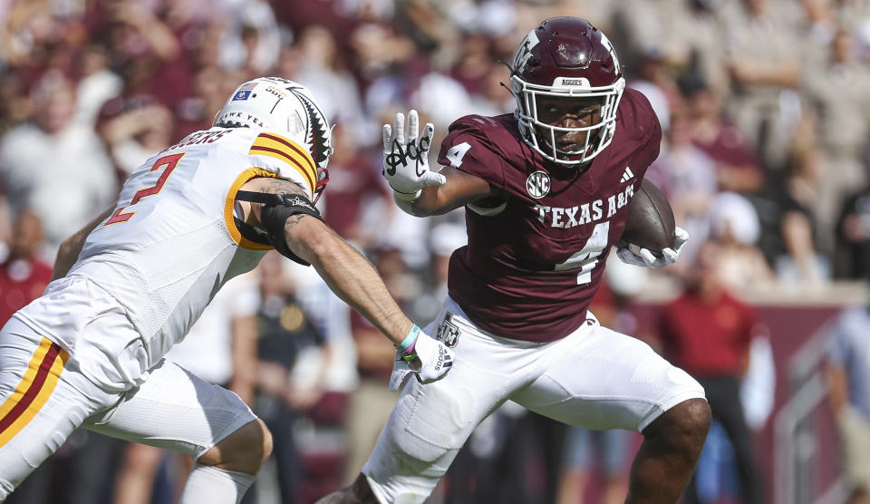 Sep 16, 2023; College Station, Texas; Texas A&M Aggies running back Amari Daniels (4) runs with the ball as Louisiana Monroe Warhawks linebacker Tristan Driggers (2) defends during the first quarter at Kyle Field. Troy Taormina-USA TODAY Sports