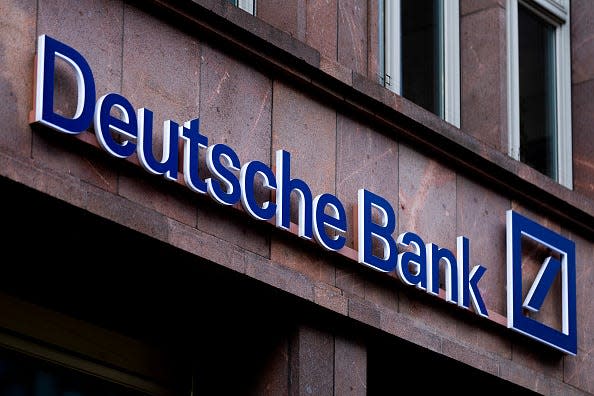 The Deutsche Bank logo on a building, with blue and white lettering.