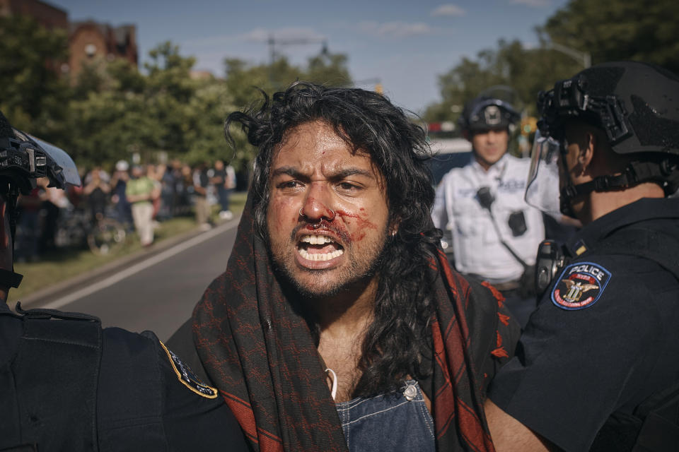 A pro-Palestinian demonstrator is detained by police during a protest demanding a permanent cease-fire in Gaza on Friday, May 31, 2024, in the Brooklyn borough of New York. (AP Photo/Andres Kudacki)