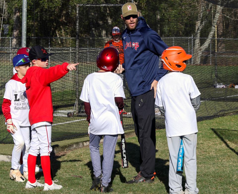 Boston Red Sox pitcher Chris Sale, a Lakeland High grad, works with youths during the Evan Michael Chambers Baseball Camp on Saturday on at Curtis Peterson Park in February. He will be among the current or former Polk County major leaguers at this weekend's Evan Michael Chambers Love Foundation High School Fall Baseball Classic at Henley Field