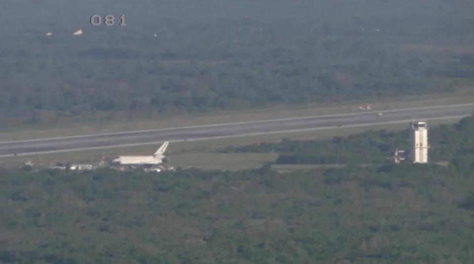 Watch the X-37B Space Plane Land Near a Space Shuttle Model