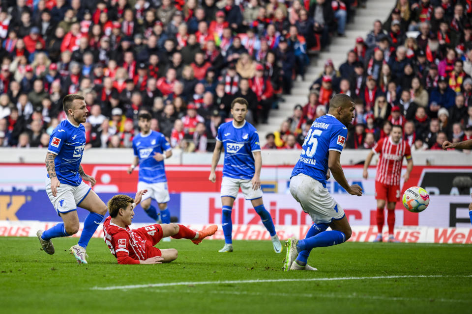 Freiburg's Ritsu Doan scores a goal to make it 2:1 during the German Bundesliga soccer match between TSG 1899 Hoffenheim and SC Freiburg in Freiburg im Breisgau, Germany, Sunday March 12, 2023. (Tom Weller/dpa via AP)