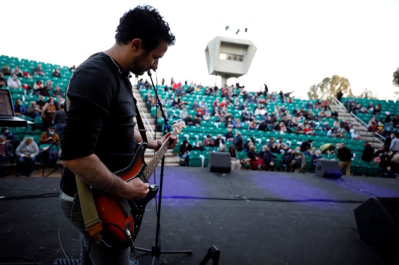 Vaccinated seniors attend a show at Tel Aviv park