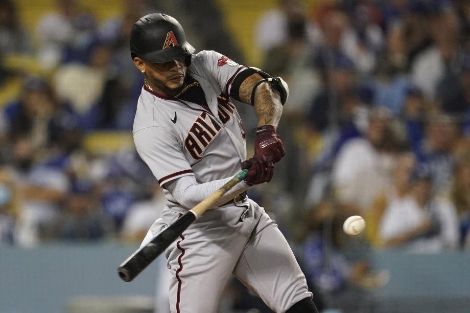 Arizona Diamondbacks' Ketel Marte connects for a three-run home run during the seventh inning of the team's baseball game against the Los Angeles Dodgers on Tuesday, Sept. 14, 2021, in Los Angeles. (AP Photo/Marcio Jose Sanchez)