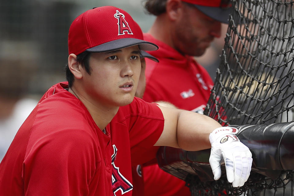 Los Angeles Angels' Shohei Ohtani looks on during batting practice before the start of a baseball game against the Chicago White Sox Saturday, Sept. 7, 2019, in Chicago. (AP Photo/Jim Young)