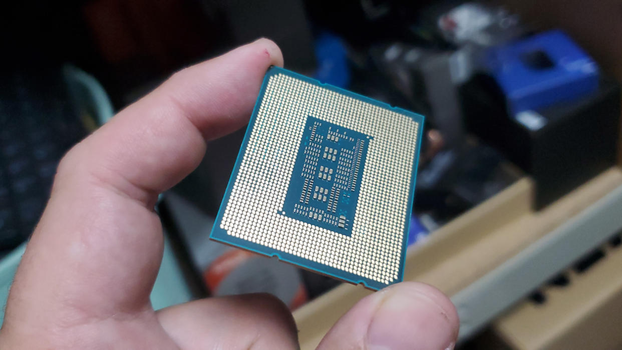 Intel Core i9 13900K processor in a hand 