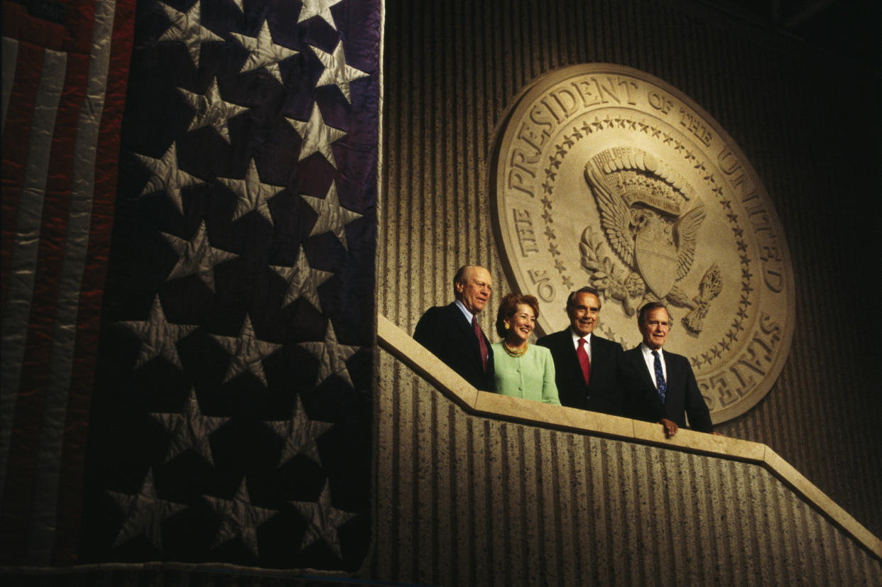 Republican presidential candidate and former Senator of Kansas Bob Dole appears with his wife Elizabeth, former Presidents Gerald Ford, left, and George H.W. Bush during the last days of his campaign on Nov. 1, 1996. (Ira Wyman / Sygma via Getty Images file)