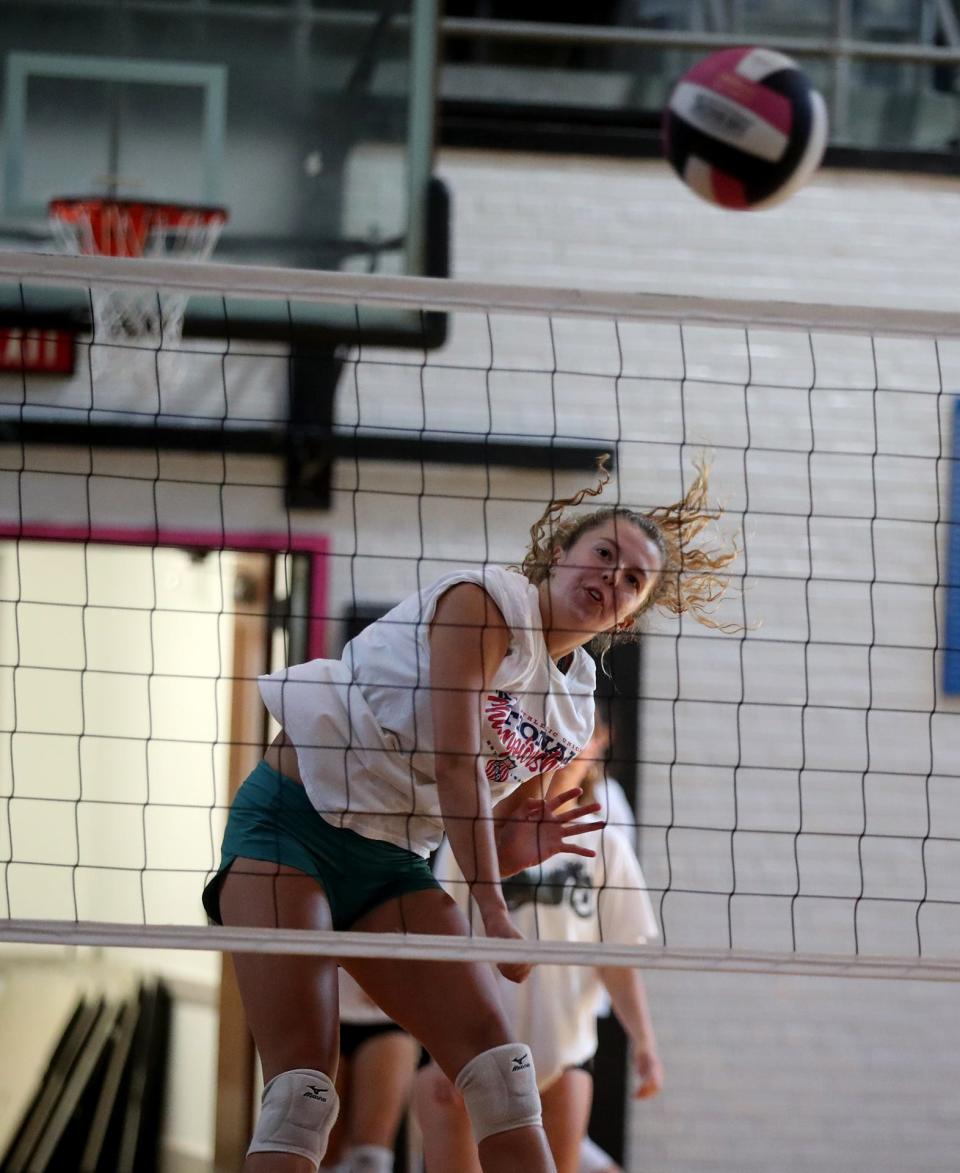 Finn Higginbotham spikes the ball as she goes for the kill during practice at Savannah Arts Academy.